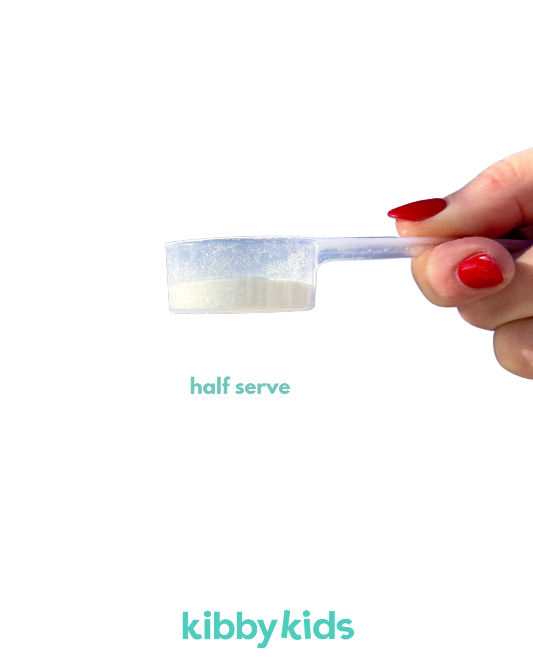 A hand with red nail polish holds a translucent plastic scoop containing white powder, with the text 'half serve' and the brand name 'kibbykids' on a plain white background.